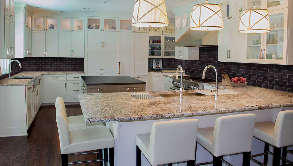 Euro-Styled Kitchen Remodel Shades of white kitchen with contrasting backsplash